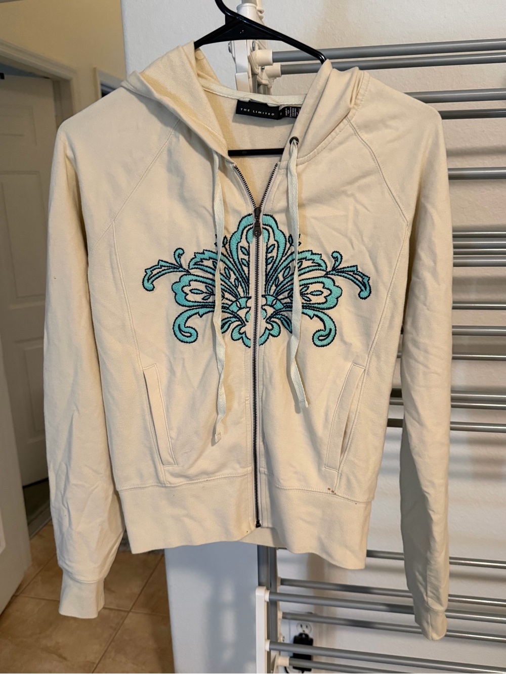 The Limited Cream Zip Hoodie with Embroidered Accent